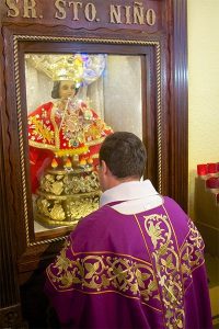 Fr Vega in front of el santo nino de cebu